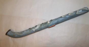 Flute by Neil Ions was purchased by the Friends in 1987 for £65. It is a long cylindrical earthenware blue flute with four finger holes and curved end. It also features moulded decoration of dolphins and other fish and was made by Neil in Gloucestershire in 1987.